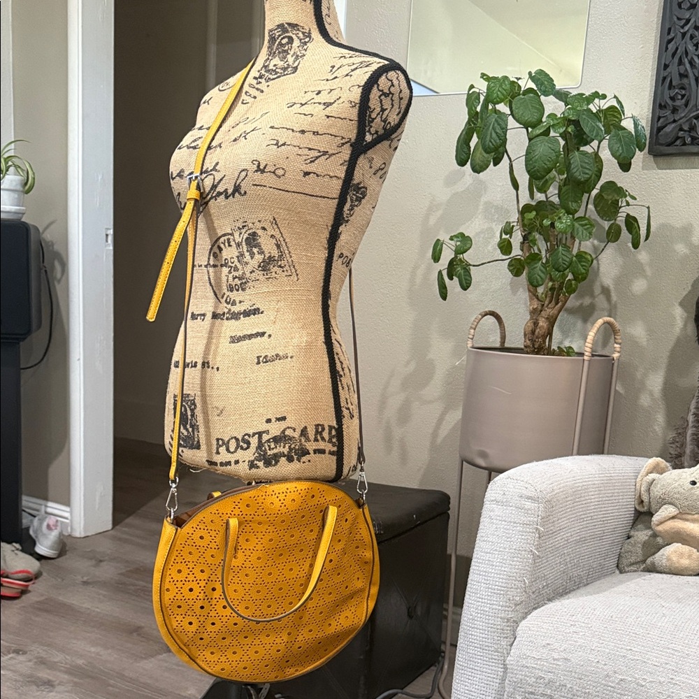Carlos Santana Yellow Laser-Cut Round Crossbody Bag
